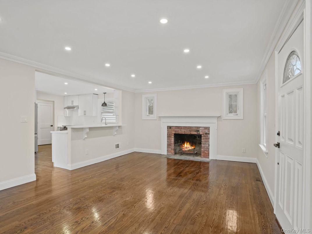Empty room, Fireplace, Interior, Kitchen, Recessed Lighting, Wood Texture Flooring