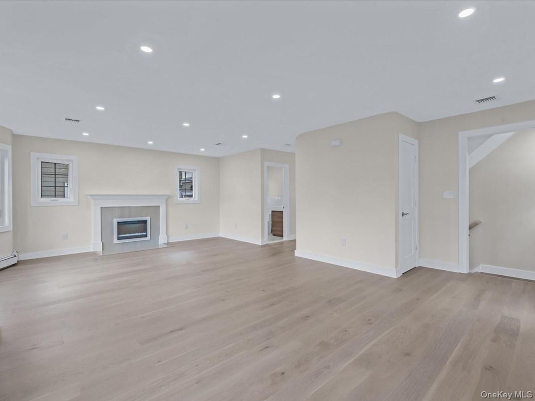 Empty room, Fireplace, Interior, Recessed Lighting, Wood Texture Flooring