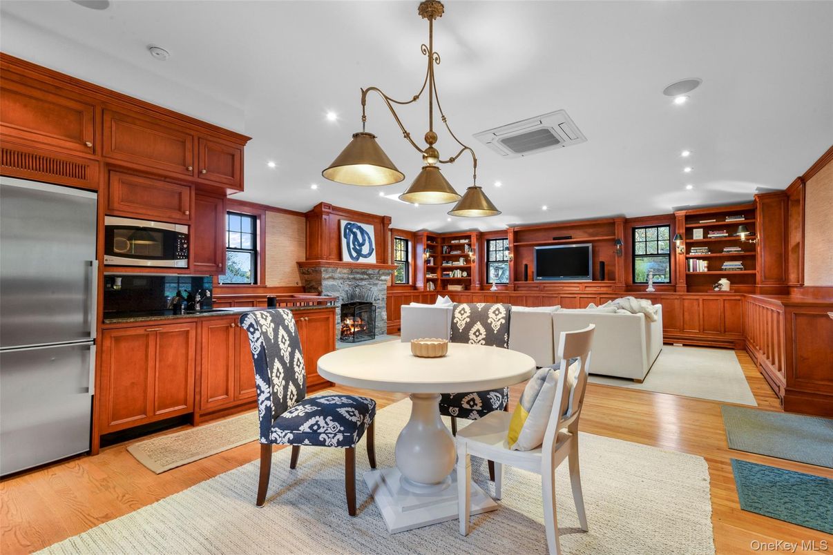 Dining room, Fireplace, Interior, Kitchen, Living room, Pendant Lights, Recessed Lighting, Stainless Steel Appliances, Wood Texture Flooring