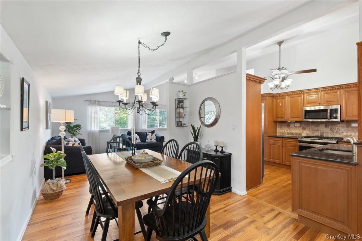 Chandelier, Dining room, Interior, Kitchen, Pendant Lights, Stainless Steel Appliances, Wood Texture Flooring
