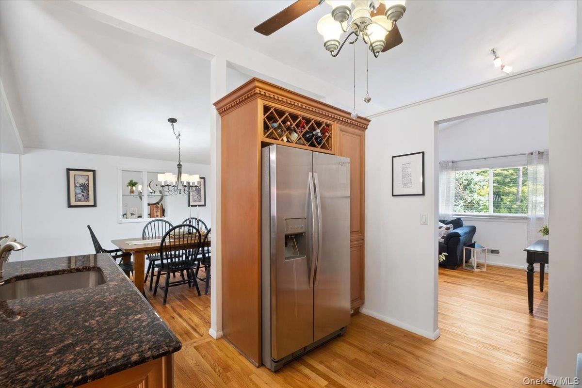 Chandelier, Dining room, Interior, Kitchen, Stainless Steel Appliances, Wood Texture Flooring