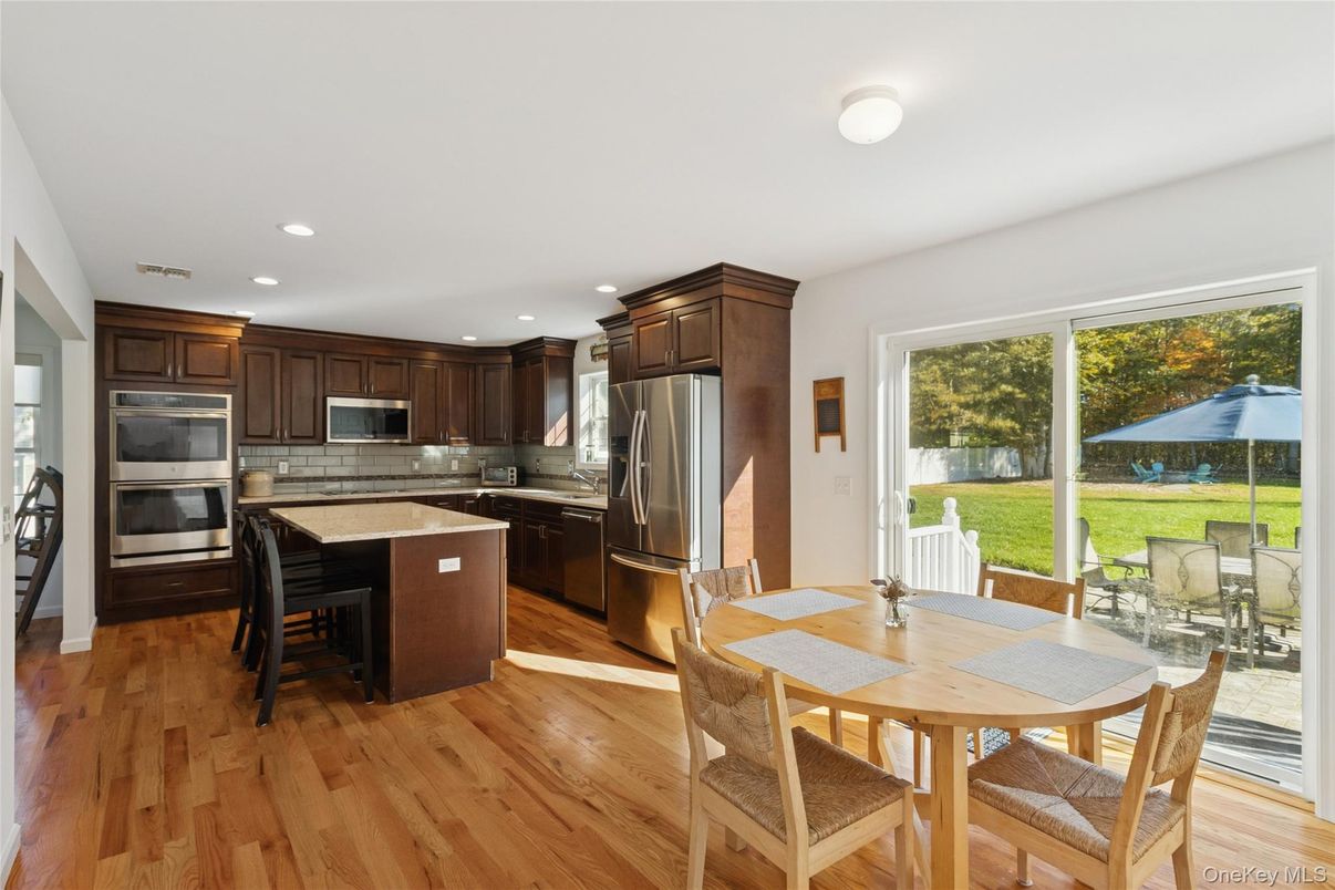 Dining room, Interior, Kitchen, Recessed Lighting, Stainless Steel Appliances, Wood Texture Flooring
