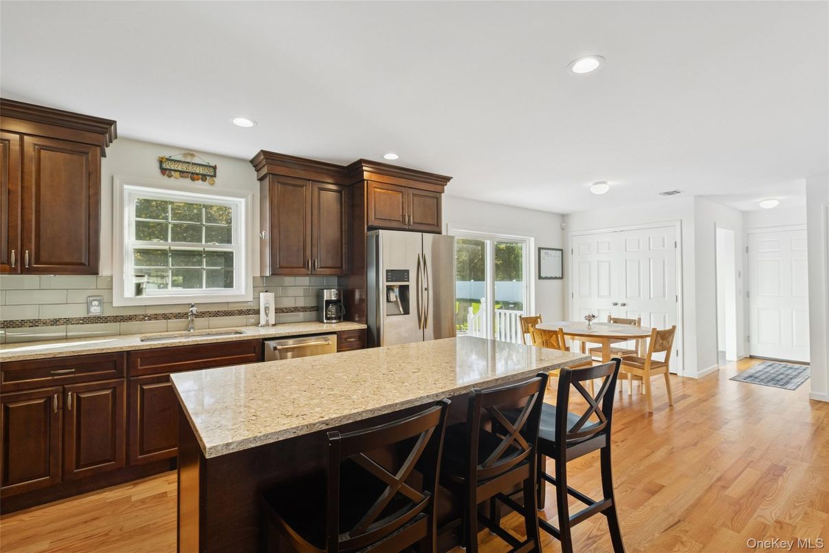 Dining room, Interior, Kitchen, Recessed Lighting, Stainless Steel Appliances, Wood Texture Flooring
