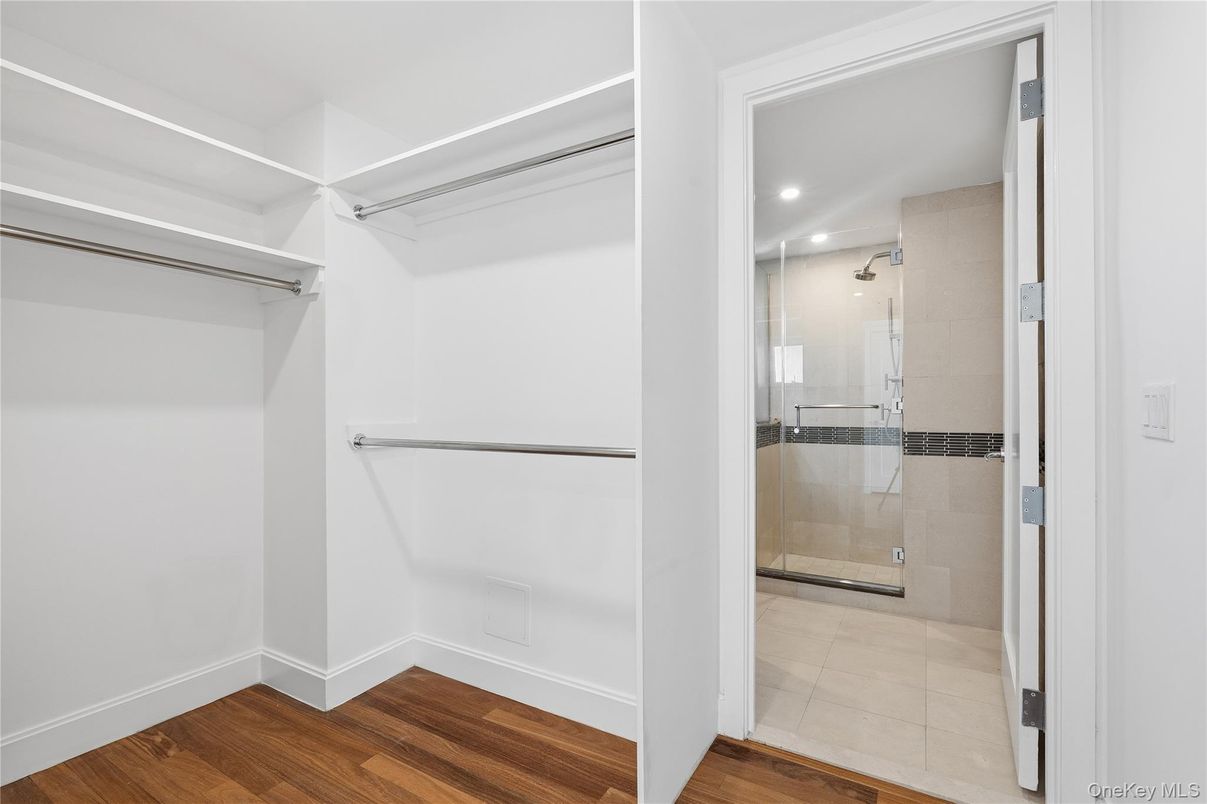 Bathroom, Glass Shower, Interior, Recessed Lighting, Walk-in Closets, Wood Texture Flooring