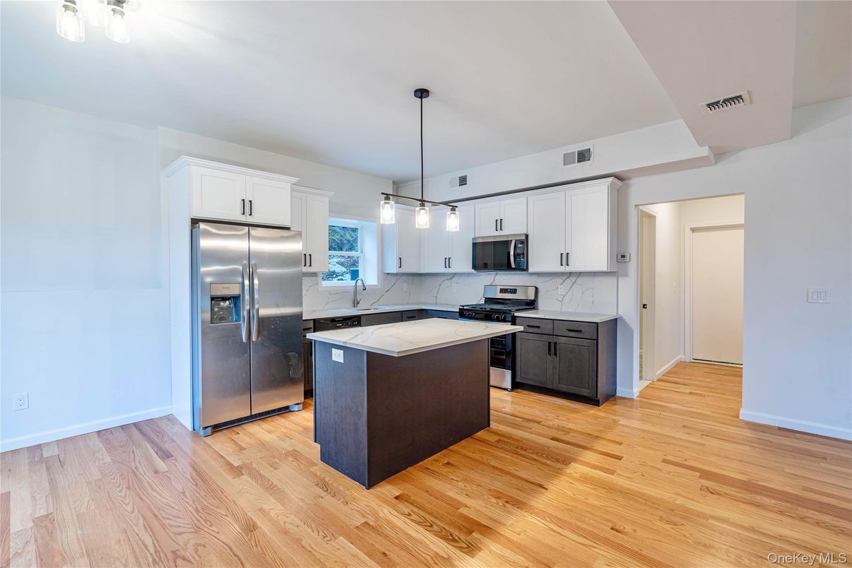 Interior, Kitchen, Marble Walls, Pendant Lights, Stainless Steel Appliances, Wood Texture Flooring