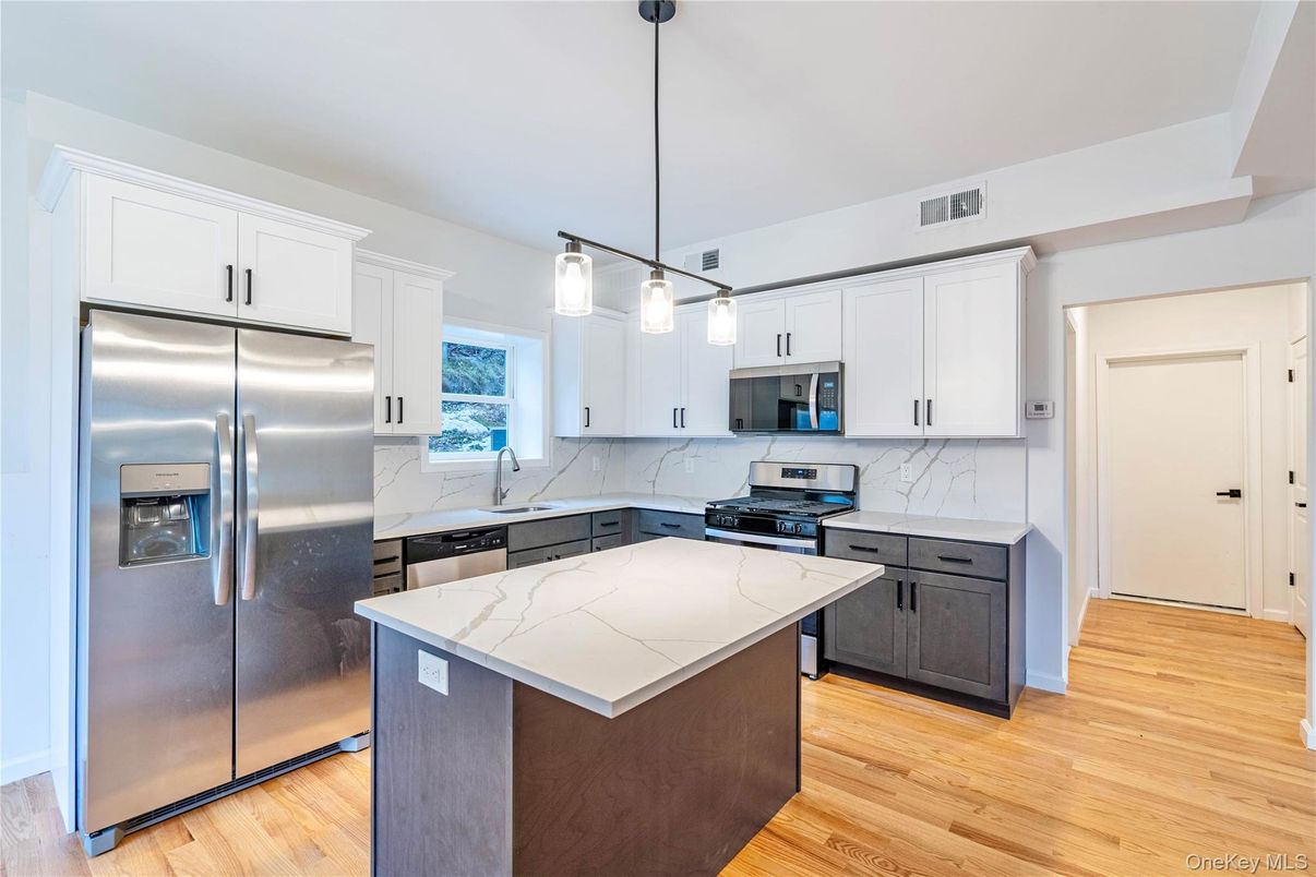 Interior, Kitchen, Marble Walls, Pendant Lights, Stainless Steel Appliances, Wood Texture Flooring