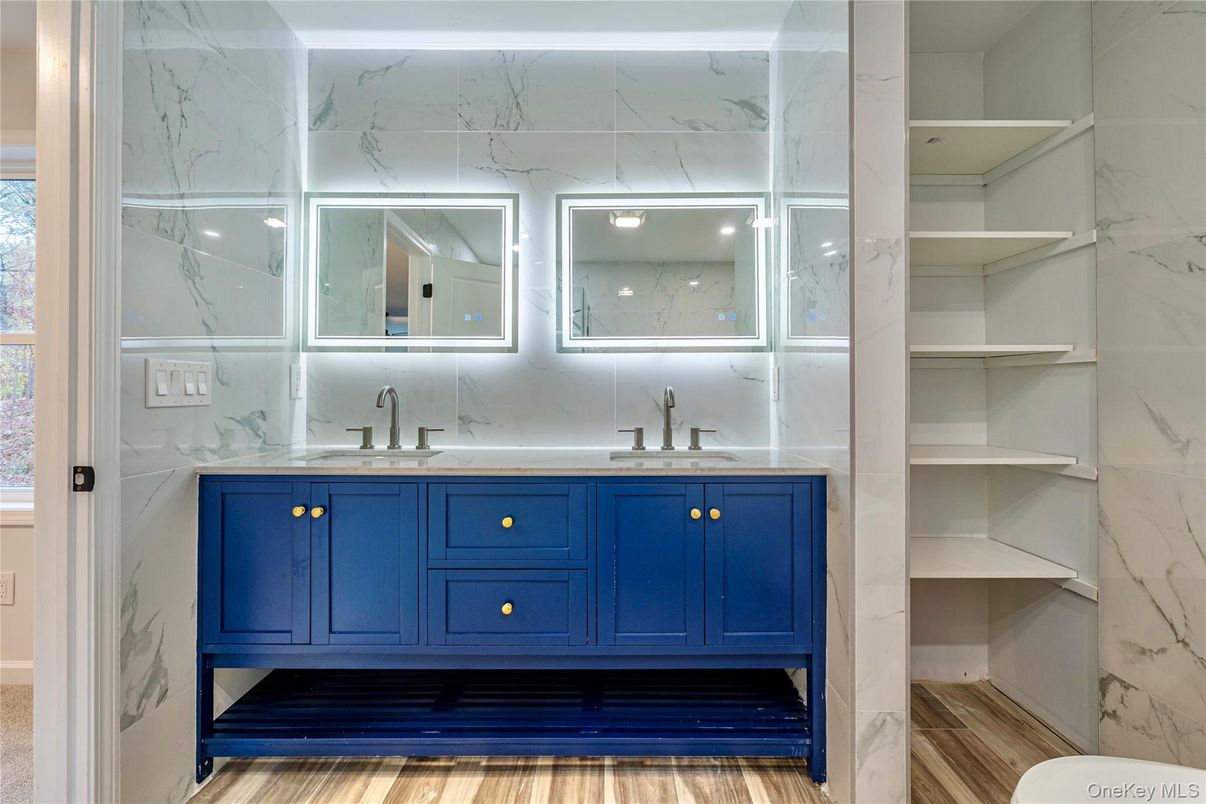 Bathroom, Dual Sink Vanities, Interior, Marble Walls, Wood Texture Flooring