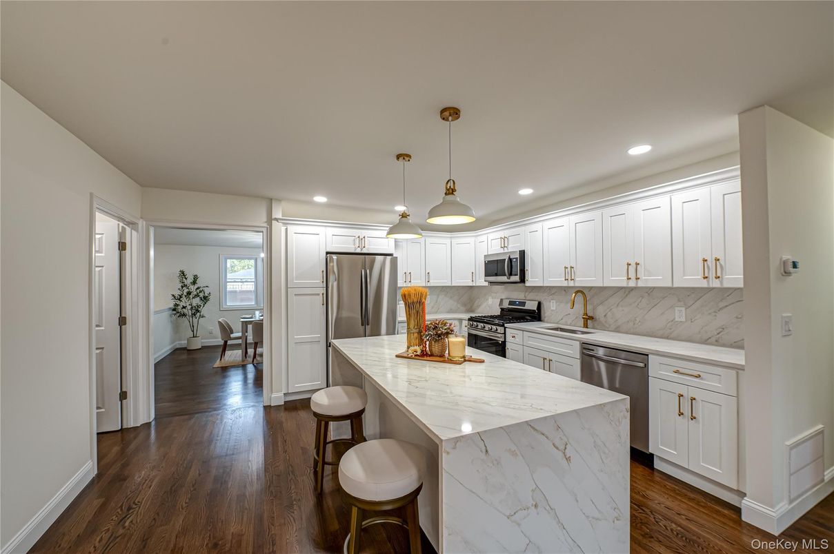 Interior, Kitchen, Marble Walls, Pendant Lights, Recessed Lighting, Stainless Steel Appliances, Wood Texture Flooring