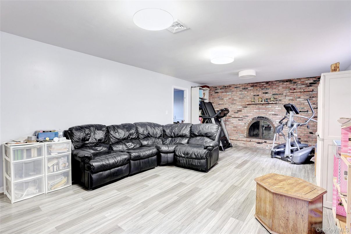 Fireplace, Fitness Equipment, Interior, Living room, Stone Walls, Wood Texture Flooring
