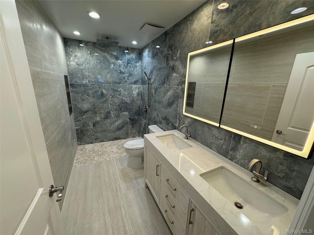 Bathroom, Dual Sink Vanities, Interior, Marble Walls, Recessed Lighting
