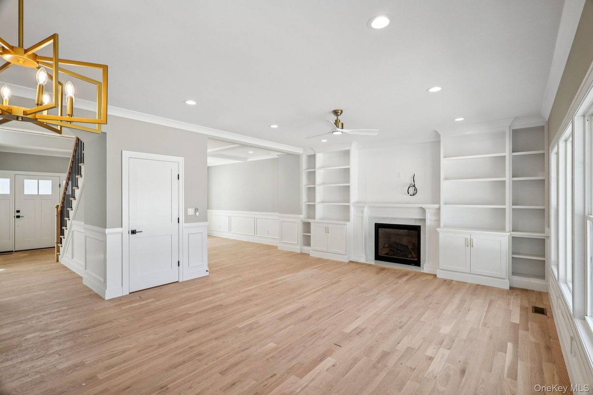 Empty room, Fireplace, Interior, Pendant Lights, Recessed Lighting, Wood Texture Flooring