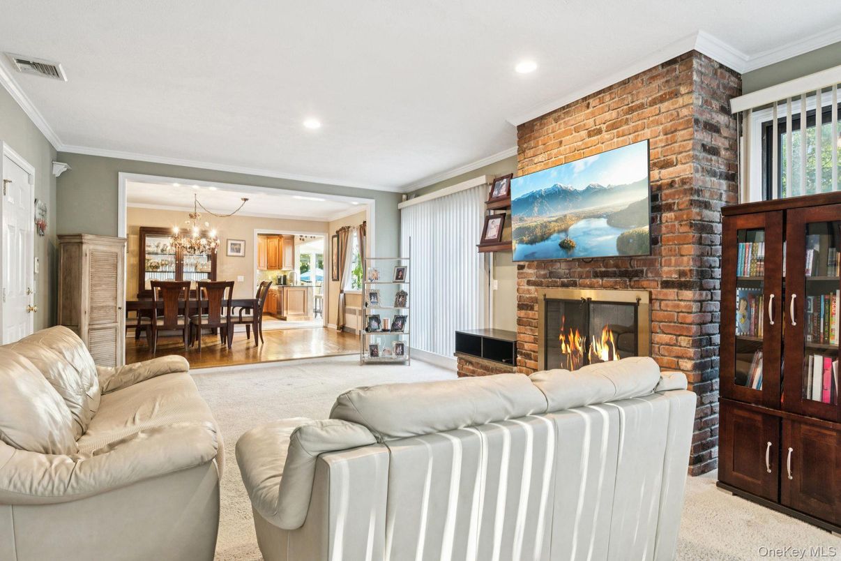 Chandelier, Dining room, Fireplace, Interior, Living room, Recessed Lighting, Stone Walls