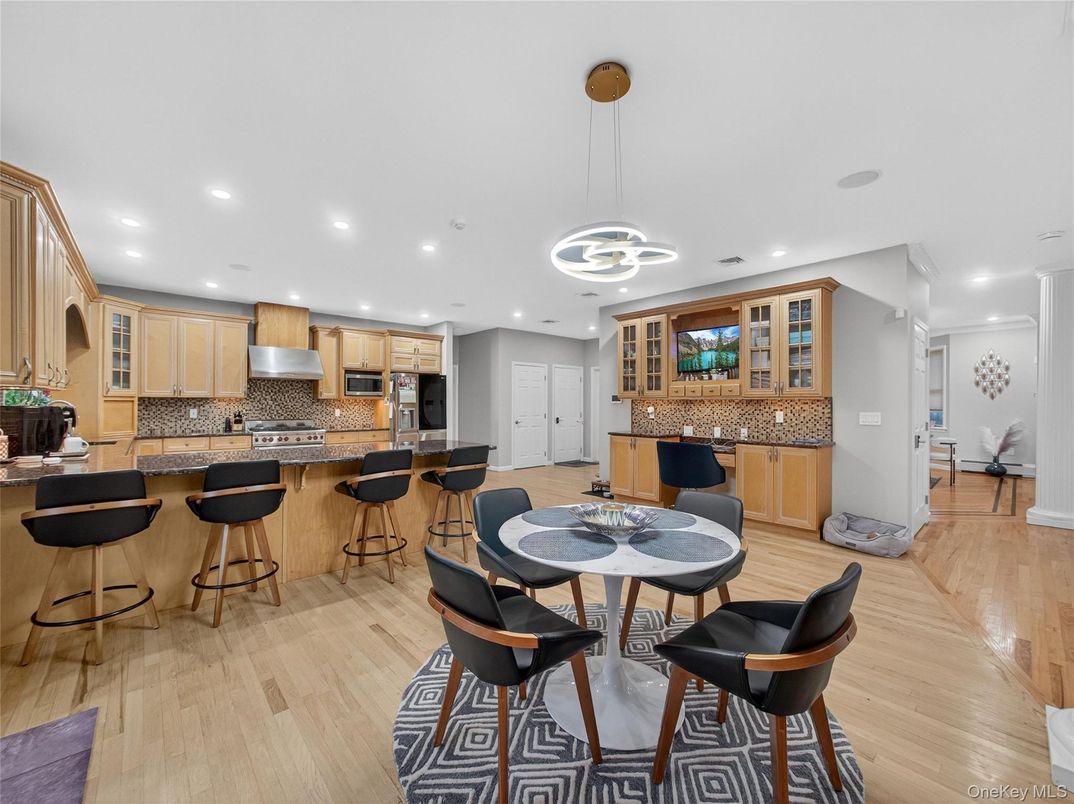 Dining room, Interior, Kitchen, Pendant Lights, Recessed Lighting, Stainless Steel Appliances, Wood Texture Flooring