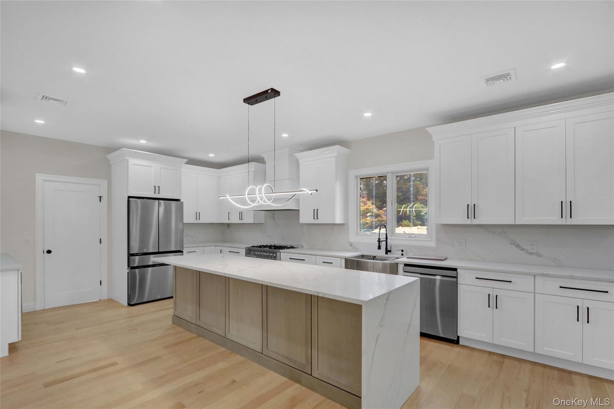 Interior, Kitchen, Marble Walls, Pendant Lights, Recessed Lighting, Stainless Steel Appliances, Wood Texture Flooring