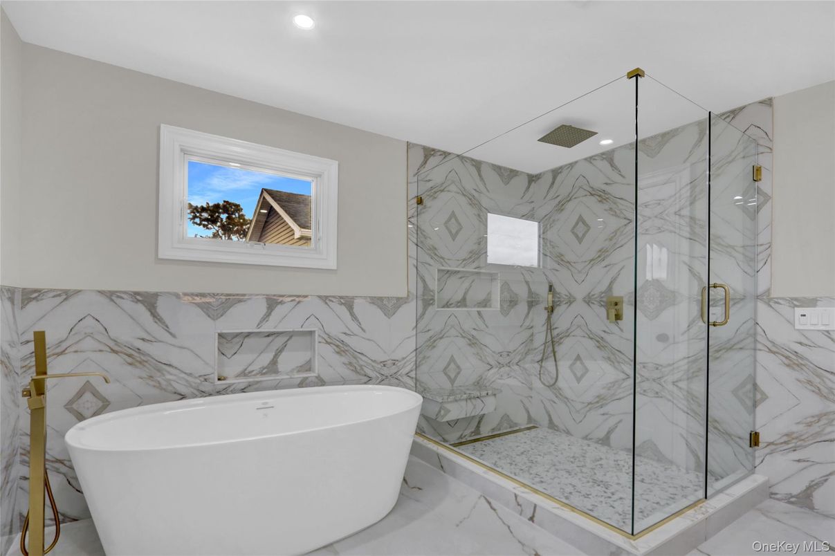 Bathroom, Free Standing Baths, Glass Shower, Interior, Marble, Marble Walls, Recessed Lighting