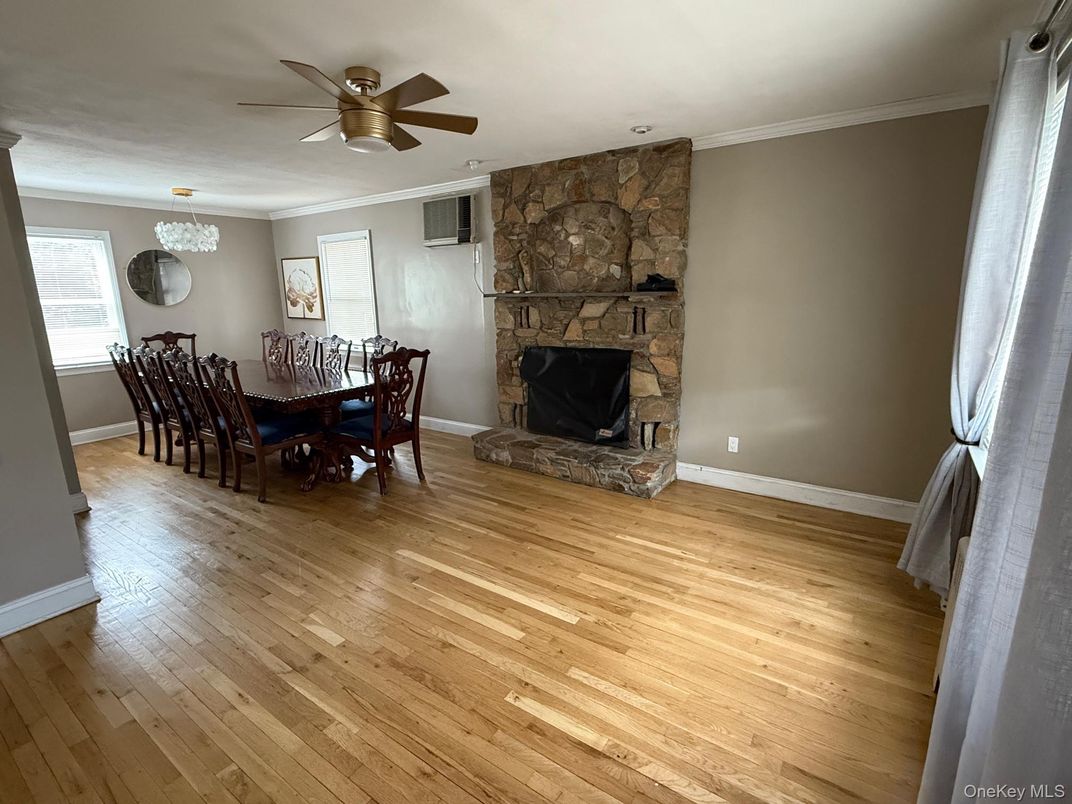 Chandelier, Dining room, Fireplace, Interior, Stone Walls, Wood Texture Flooring