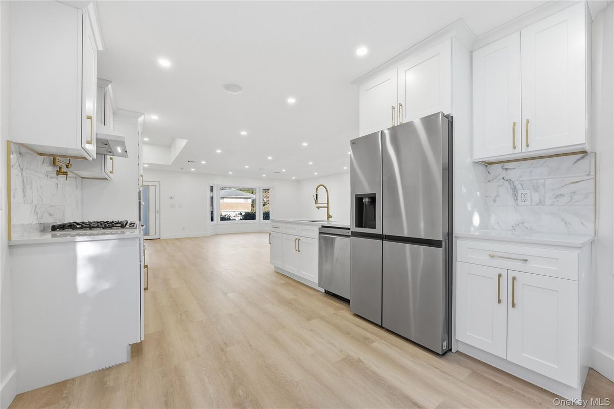 Interior, Kitchen, Marble Walls, Recessed Lighting, Stainless Steel Appliances, Wood Texture Flooring