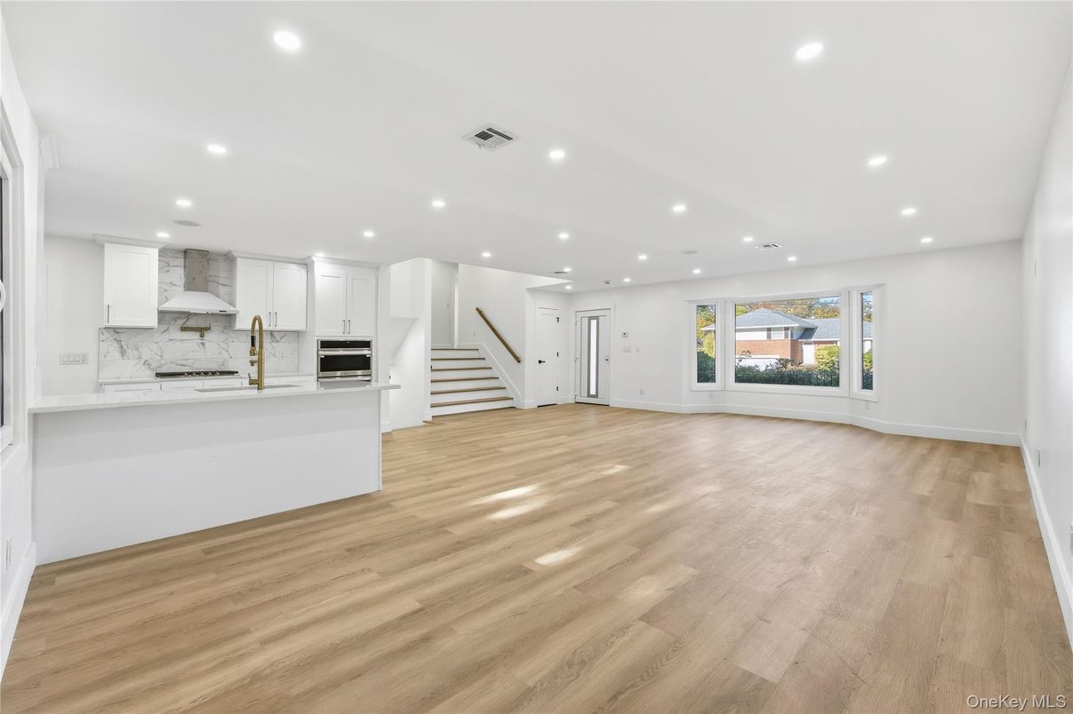 Interior, Kitchen, Marble Walls, Recessed Lighting, Stainless Steel Appliances, Wood Texture Flooring