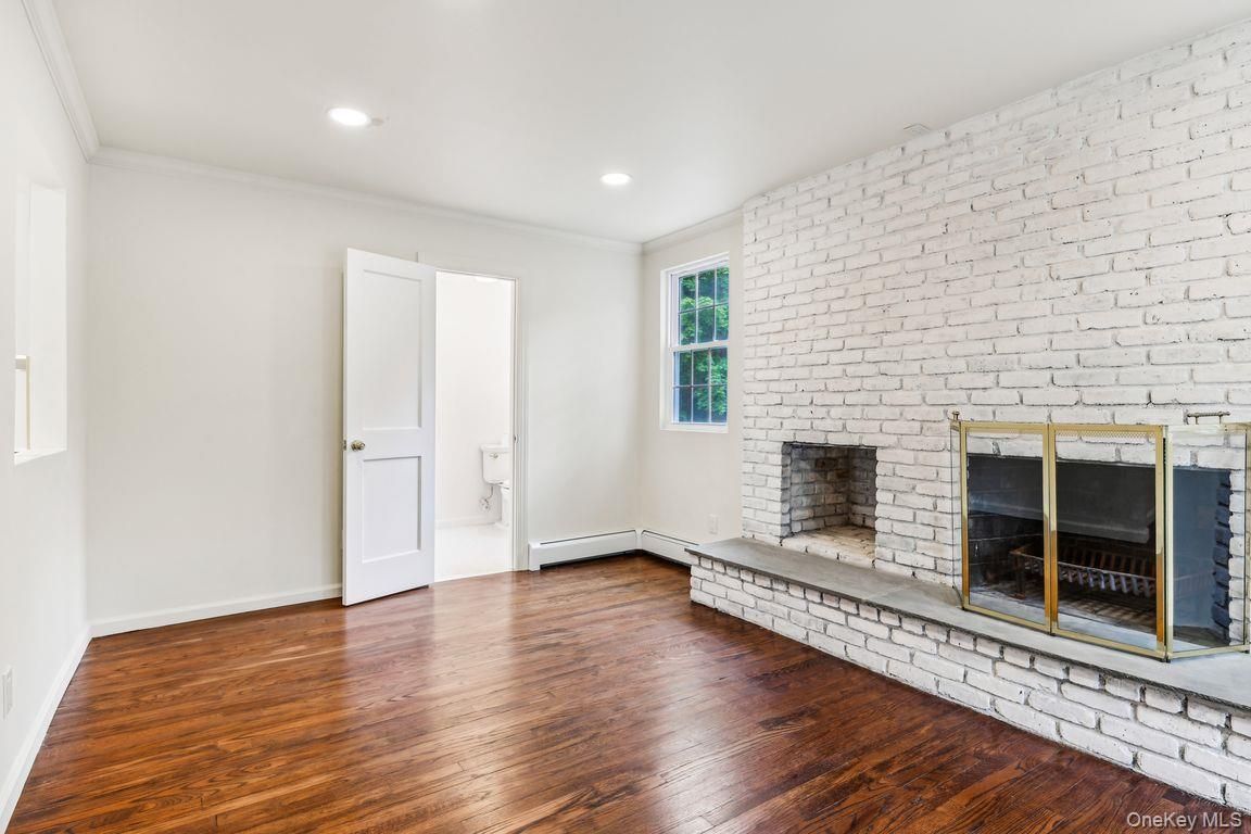 Empty room, Fireplace, Interior, Recessed Lighting, Stone Walls, Wood Texture Flooring