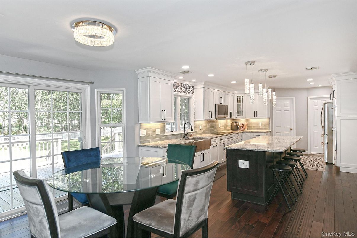 Dining room, Interior, Kitchen, Pendant Lights, Recessed Lighting, Stainless Steel Appliances, Wood Texture Flooring