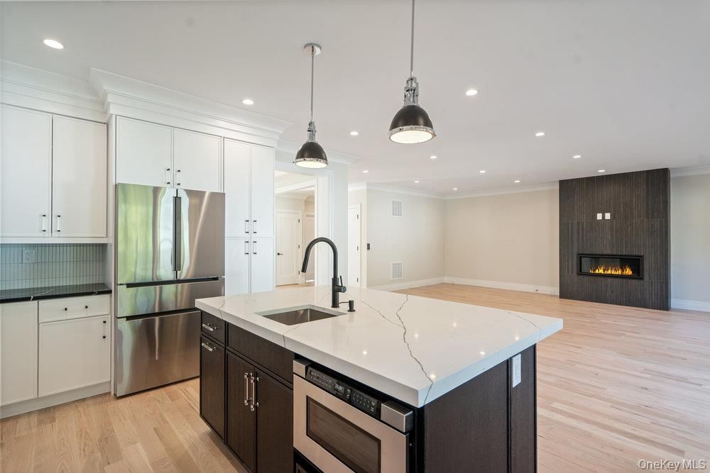 Fireplace, Interior, Kitchen, Pendant Lights, Recessed Lighting, Stainless Steel Appliances, Wood Texture Flooring