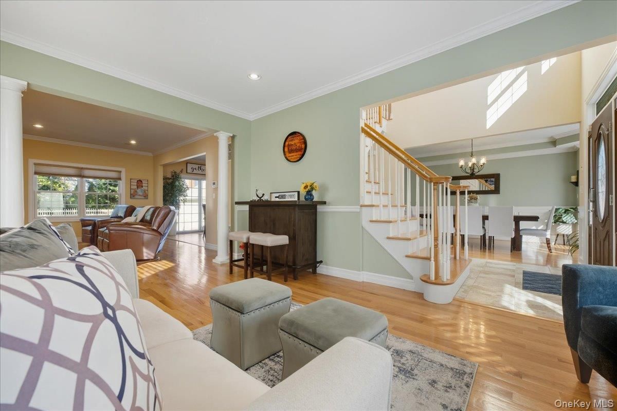 Chandelier, Dining room, Interior, Living room, Piano, Recessed Lighting, Wood Texture Flooring