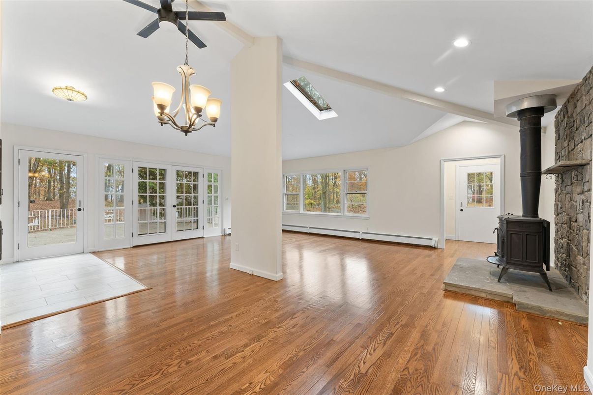 Chandelier, Empty room, Fireplace, Interior, Recessed Lighting, Wood Texture Flooring