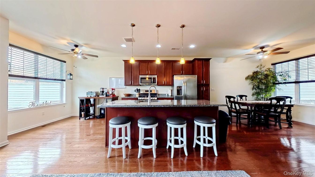 Dining room, Interior, Kitchen, Pendant Lights, Recessed Lighting, Stainless Steel Appliances, Wood Texture Flooring