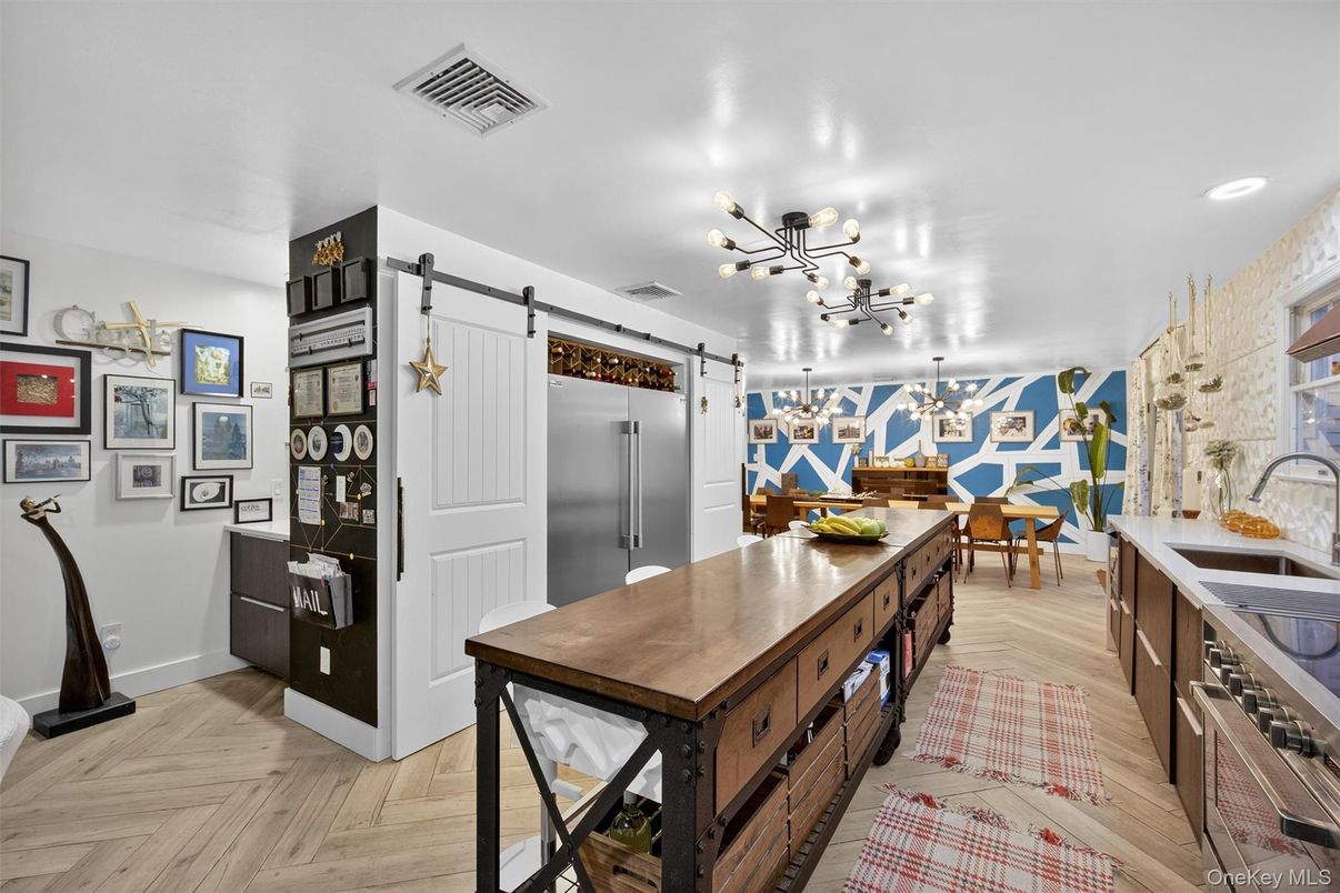 Dining room, Interior, Kitchen, Pendant Lights, Recessed Lighting, Stainless Steel Appliances, Wood Texture Flooring