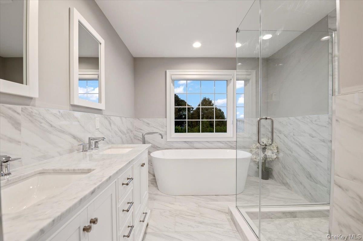 Bathroom, Dual Sink Vanities, Free Standing Baths, Glass Shower, Interior, Marble, Marble Walls, Recessed Lighting