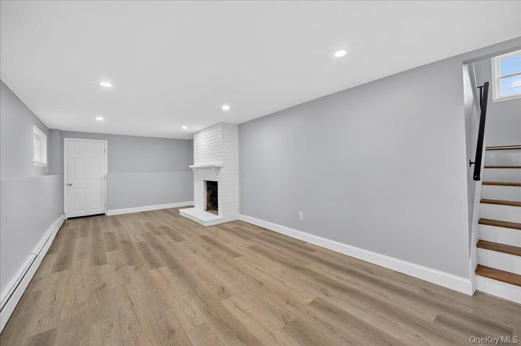 Empty room, Fireplace, Interior, Recessed Lighting, Wood Texture Flooring
