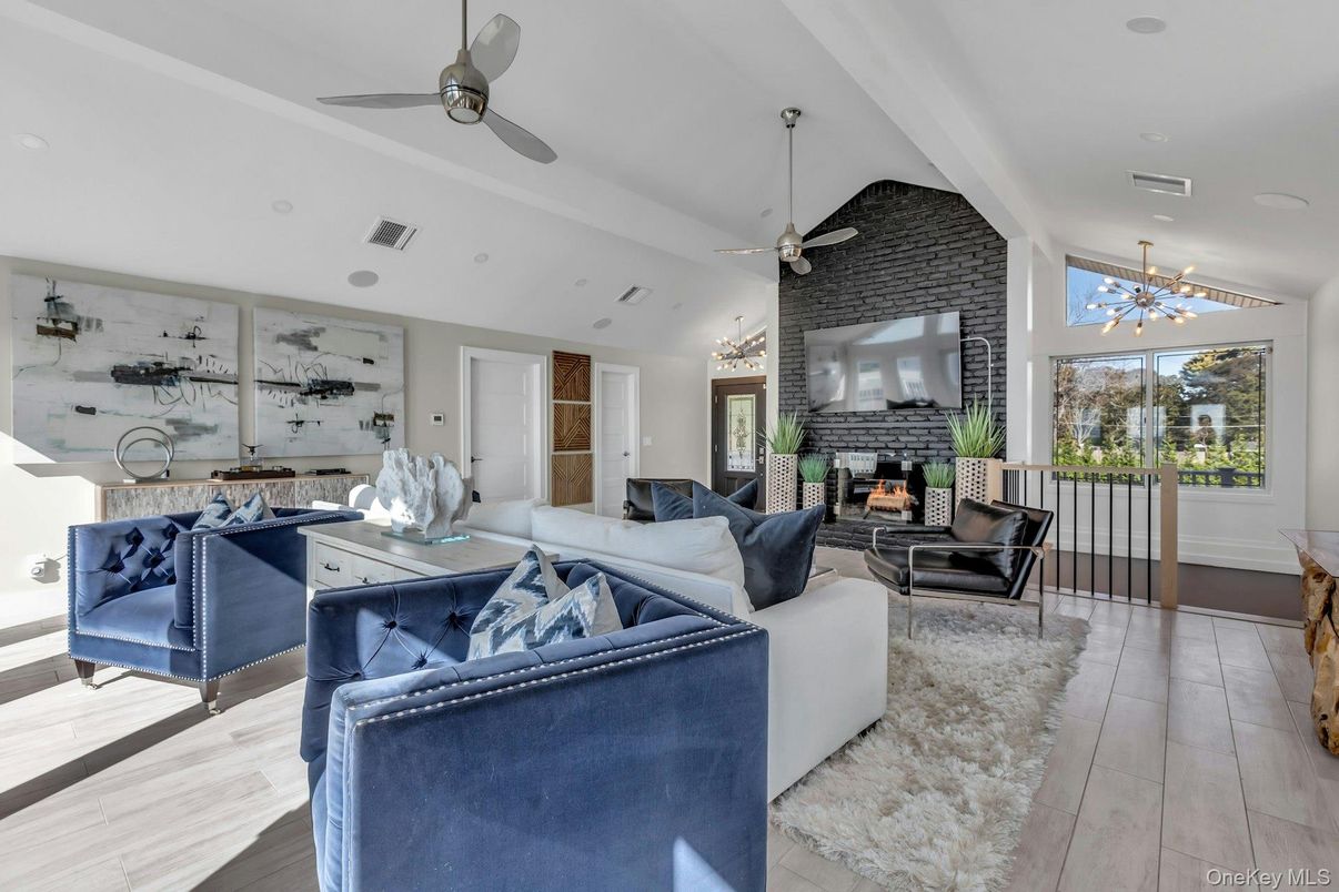 Fireplace, Interior, Living room, Pendant Lights, Recessed Lighting, Stone Walls, Wood Texture Flooring