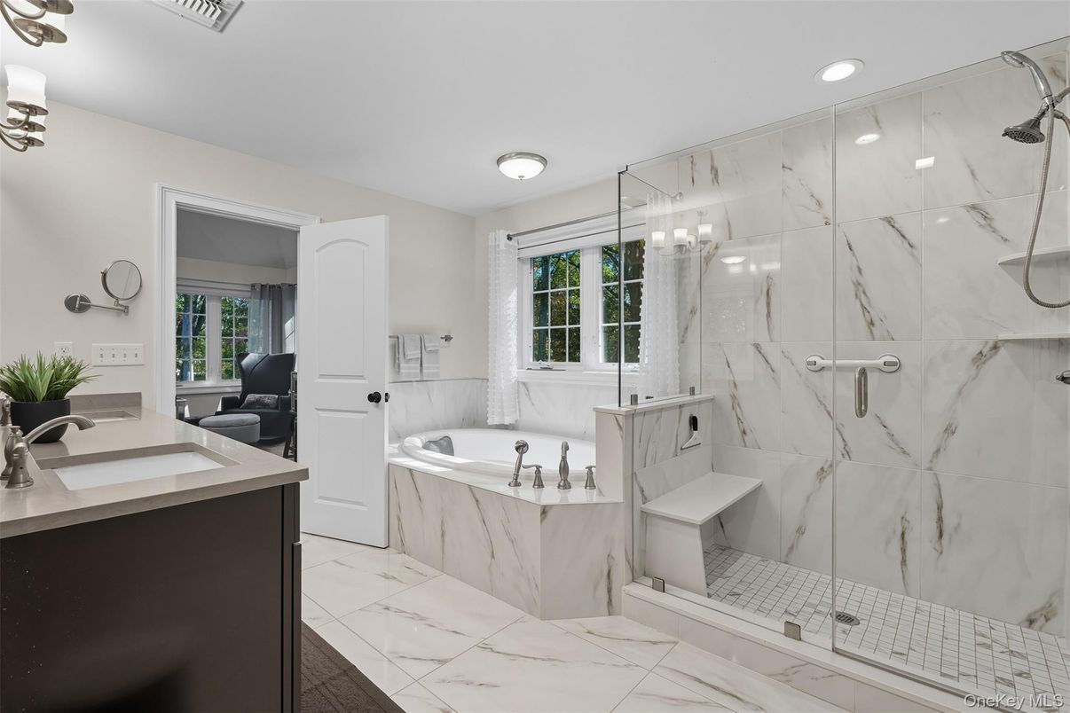 Bathroom, Dual Sink Vanities, Glass Shower, Interior, Marble, Marble Walls, Recessed Lighting