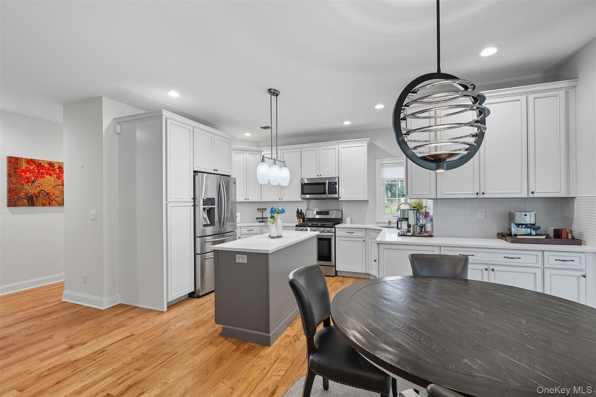 Dining room, Interior, Kitchen, Pendant Lights, Recessed Lighting, Stainless Steel Appliances, Wood Texture Flooring