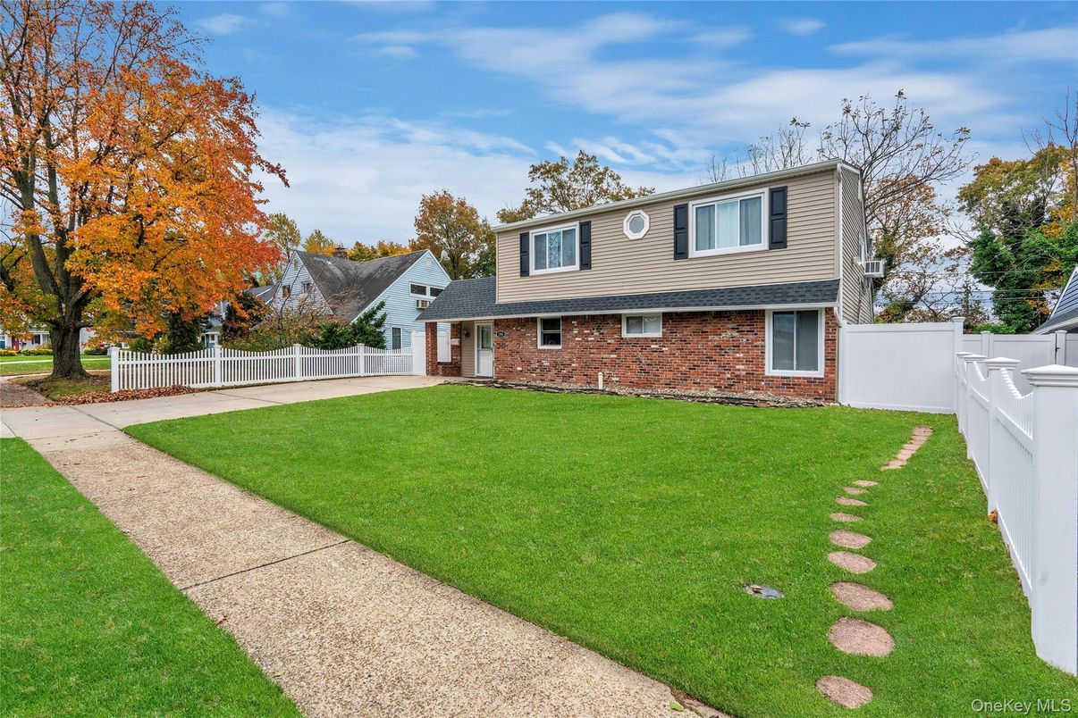 Attached, Backyard, Exterior, Facade, Brick Facade, Split Level