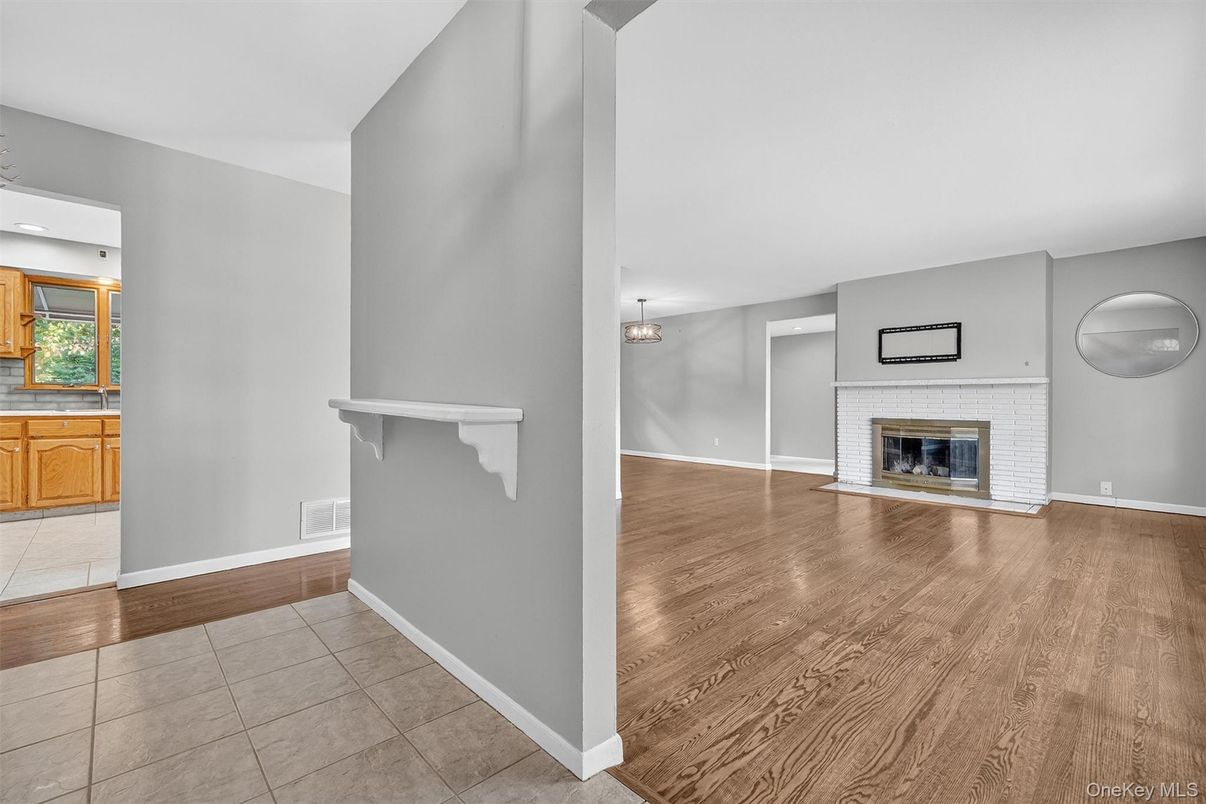 Empty room, Fireplace, Interior, Kitchen, Pendant Lights, Wood Texture Flooring