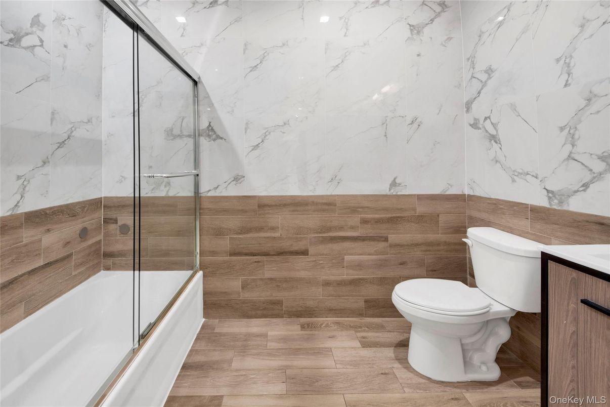 Bathroom, Glass Shower, Interior, Marble Walls, Wood Texture Flooring