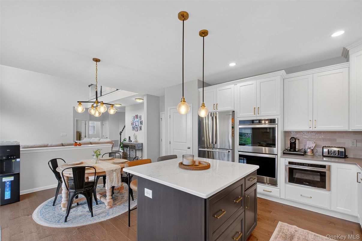 Dining room, Interior, Kitchen, Pendant Lights, Recessed Lighting, Stainless Steel Appliances, Wood Texture Flooring