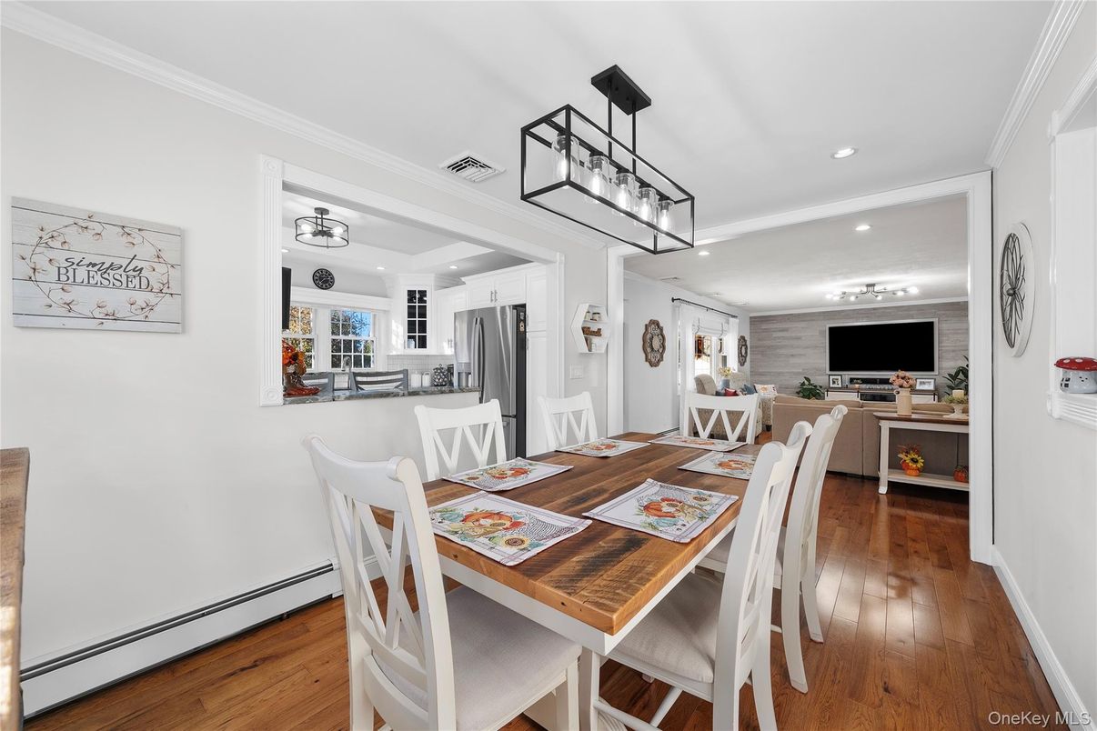 Dining room, Interior, Kitchen, Pendant Lights, Recessed Lighting, Stainless Steel Appliances, Wood Texture Flooring