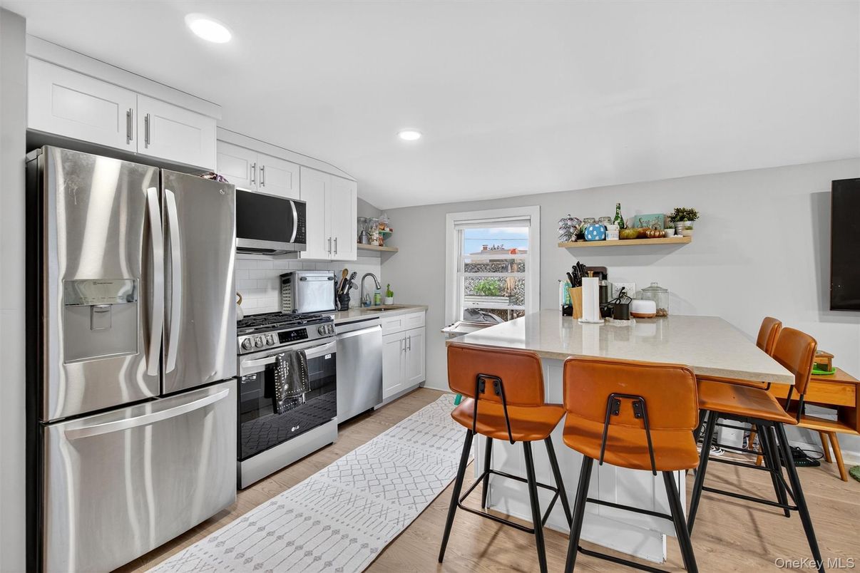 Dining room, Interior, Kitchen, Recessed Lighting, Stainless Steel Appliances, Wood Texture Flooring