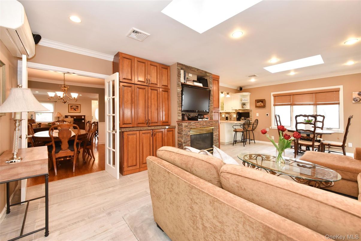 Chandelier, Dining room, Fireplace, Interior, Living room, Recessed Lighting, Wood Texture Flooring