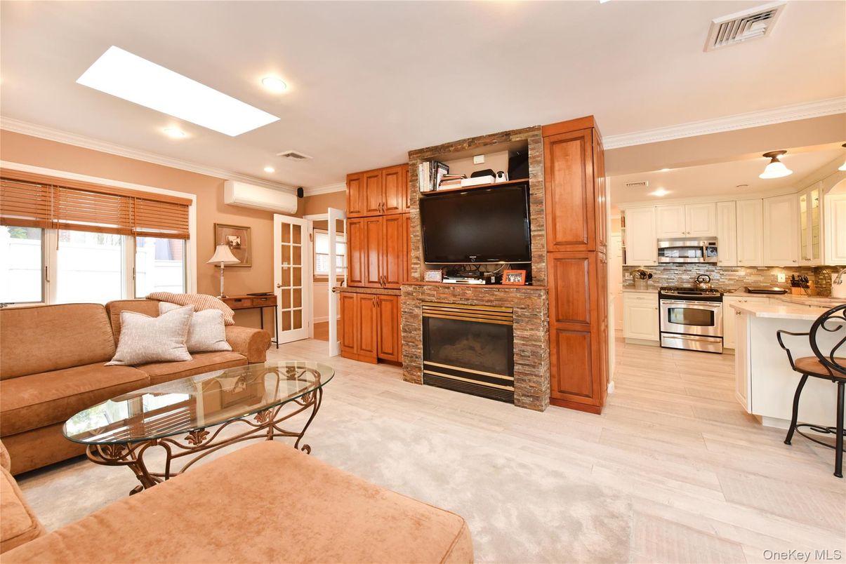 Fireplace, Interior, Kitchen, Living room, Recessed Lighting, Stainless Steel Appliances, Wood Texture Flooring