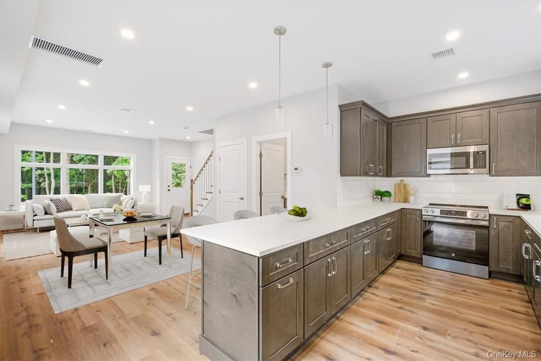 Dining room, Interior, Kitchen, Living room, Pendant Lights, Recessed Lighting, Stainless Steel Appliances, Wood Texture Flooring