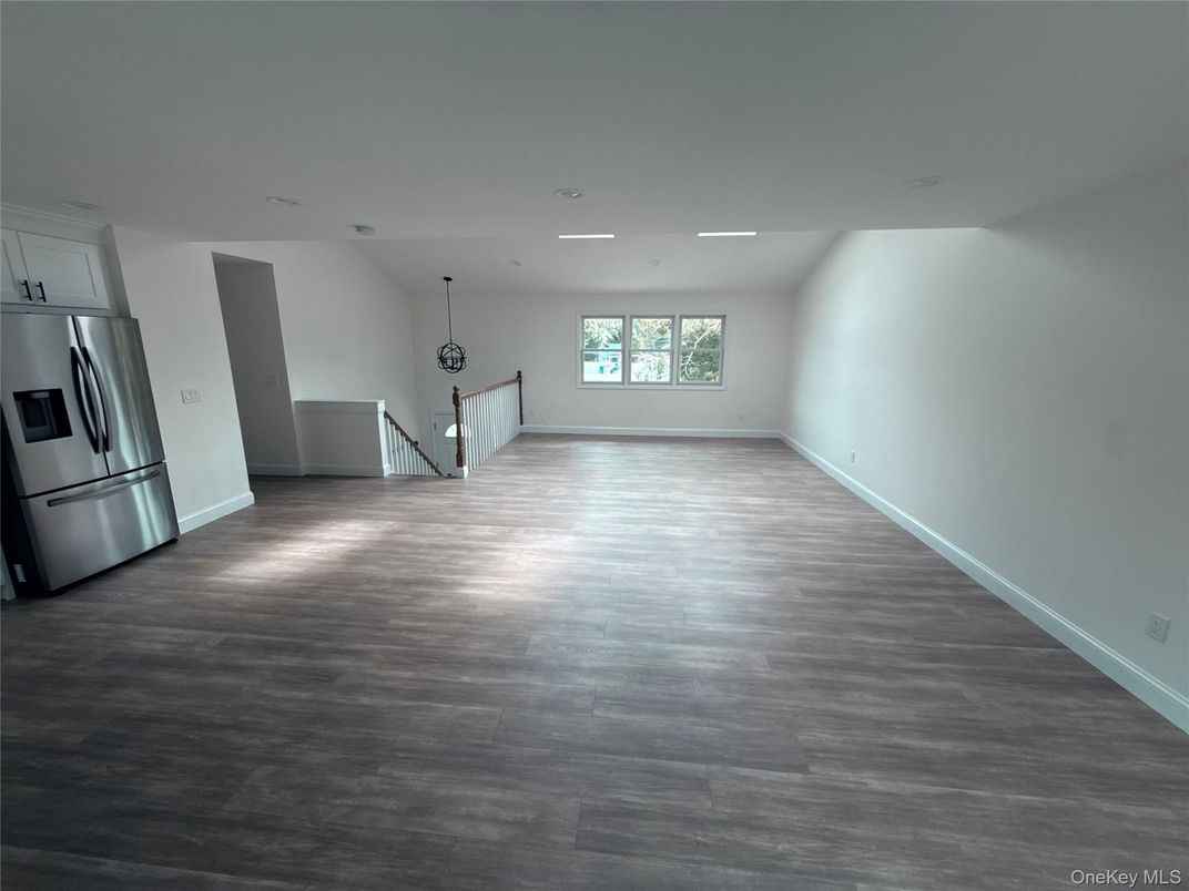 Empty room, Interior, Kitchen, Pendant Lights, Recessed Lighting, Stainless Steel Appliances, Wood Texture Flooring