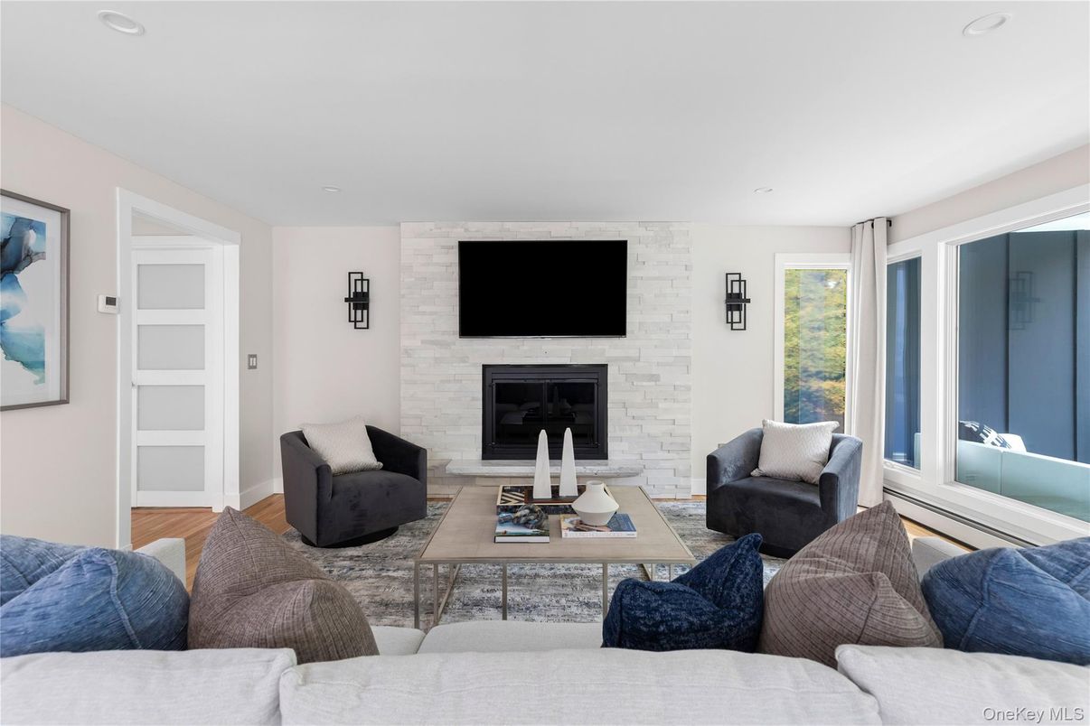 Fireplace, Interior, Living room, Recessed Lighting, Stone Walls, Wood Texture Flooring