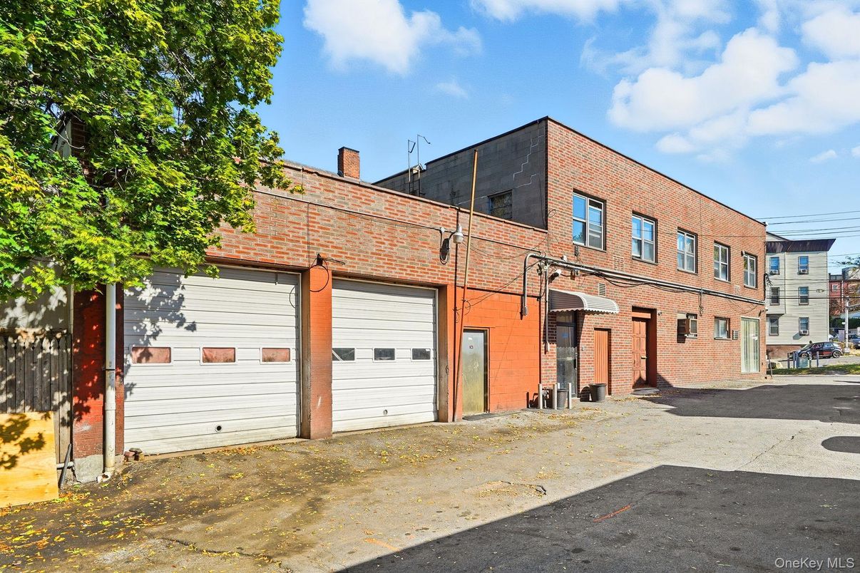 Attached, Exterior, Facade, Brick Facade, Condo Building