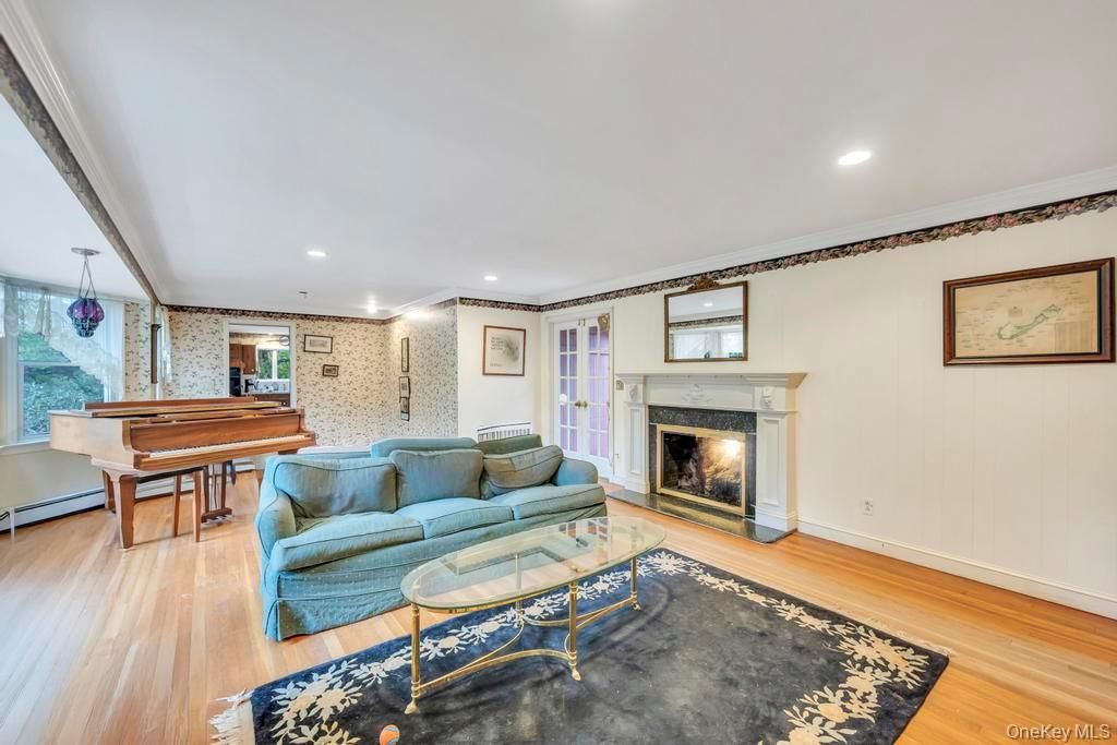 Billiard Table, Fireplace, Game Room, Interior, Living room, Pendant Lights, Piano, Recessed Lighting, Stone Walls, Wood Texture Flooring