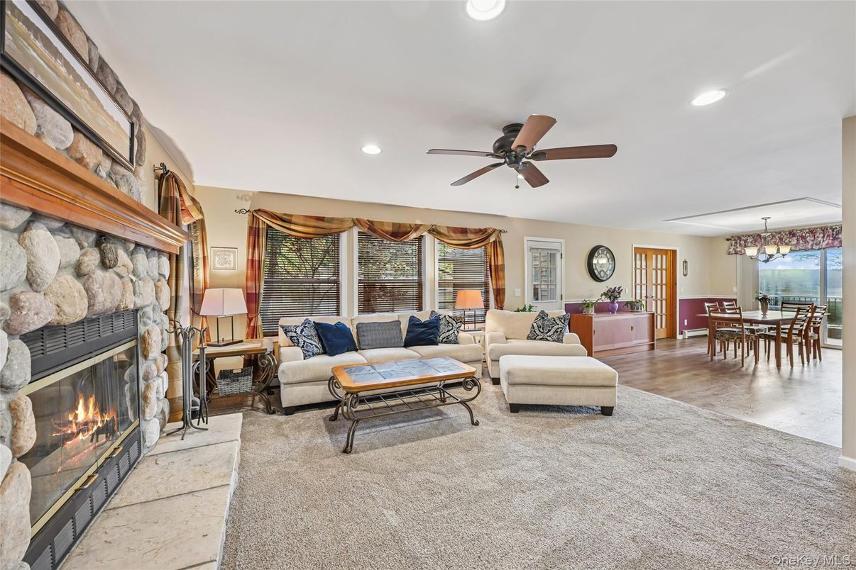 Chandelier, Dining room, Fireplace, Interior, Living room, Recessed Lighting, Stone Walls, Wood Texture Flooring