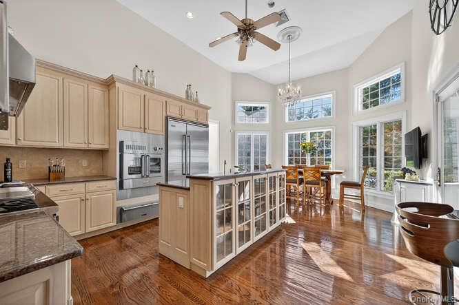 Chandelier, Dining room, Interior, Kitchen, Recessed Lighting, Stainless Steel Appliances, Wood Texture Flooring