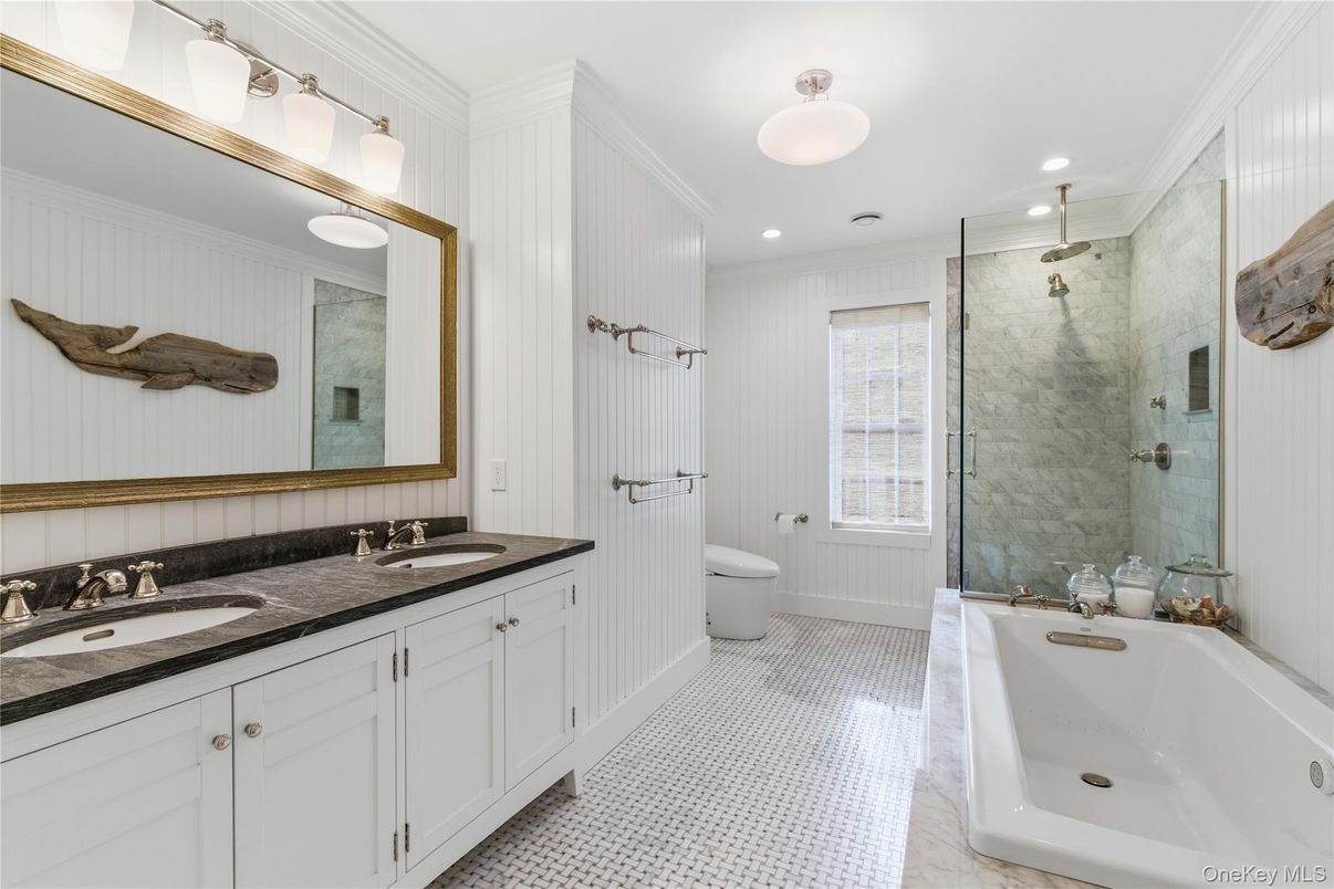 Bathroom, Dual Sink Vanities, Glass Shower, Interior, Marble Walls, Recessed Lighting